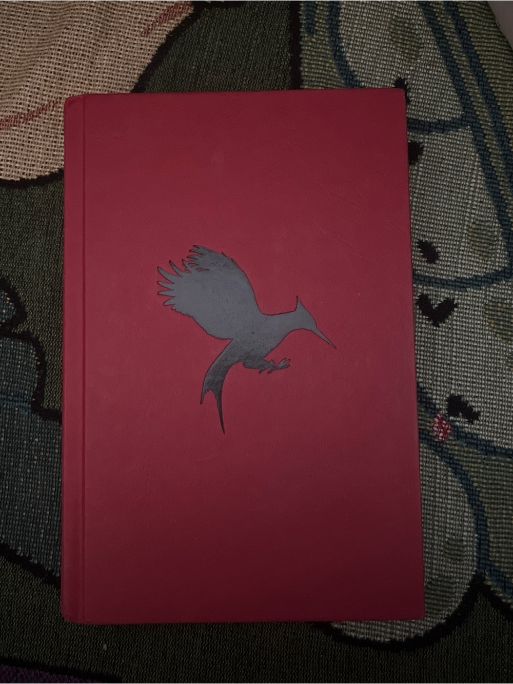 Catching Fire by Suzanne Collins Red hardcover book